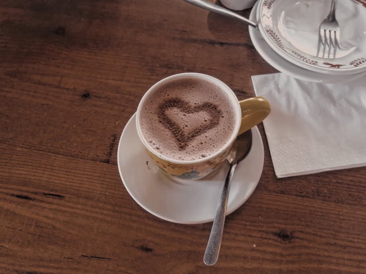 A Cup Of Coffee With A Heart Shape