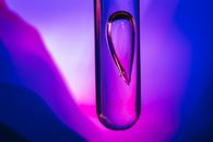 Water Drop in Purple Water