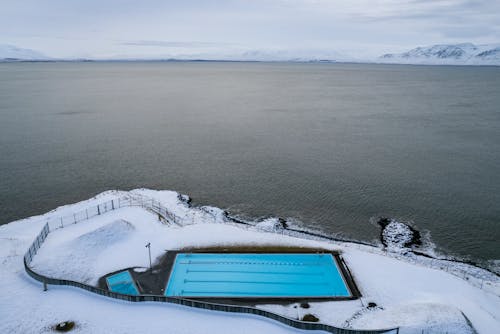 Aerial View of  Swimming Pool Near the Ocean