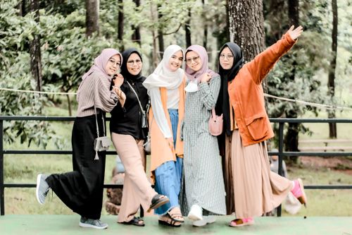 Free Group of young women outdoors enjoying friendship and togetherness. Stock Photo