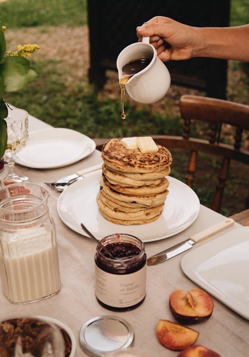 Free Pouring Honey on Pancakes Stock Photo