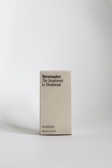 Close-up of a minimalist deodorant box with eucalyptus scent on a plain white background.