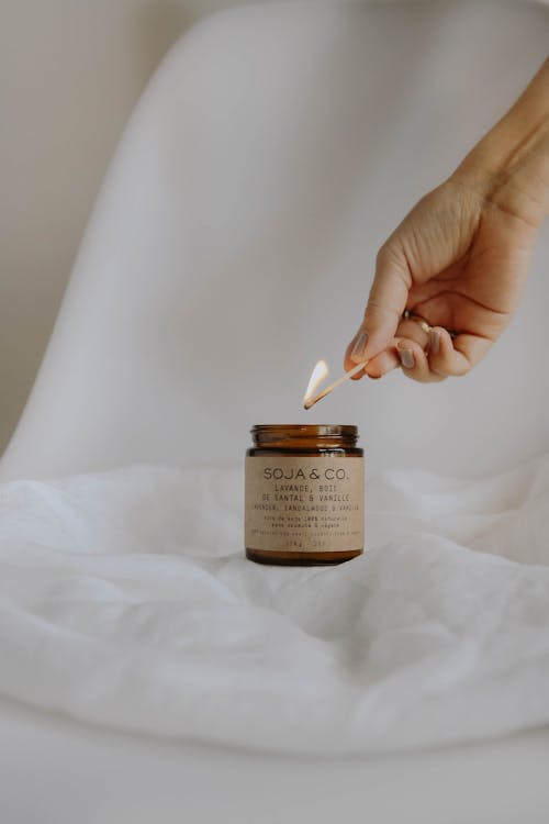 Woman Lighting up a Soy Wax Candle 