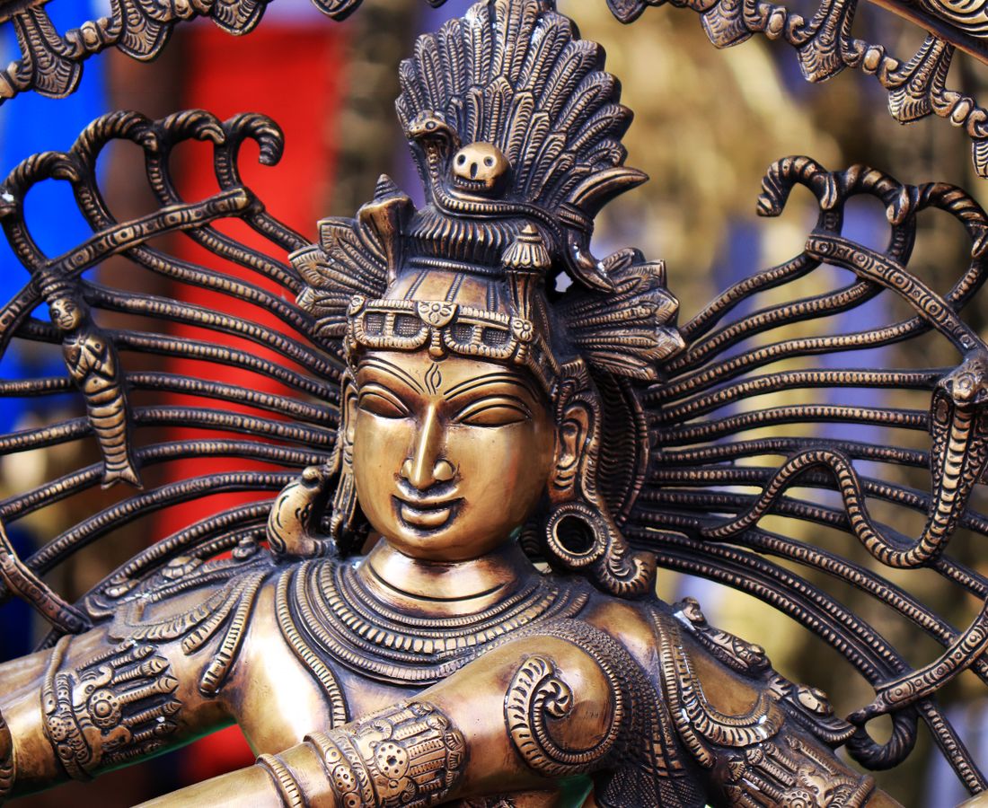 The Natyaarambam studio bathed in warm light, Nataraja watching over the wooden floor