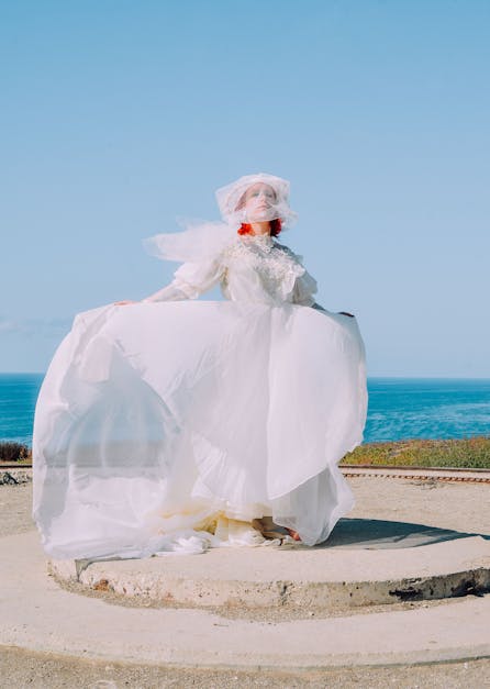 Woman in White Lace Wedding  Dress  Standing on Gray 