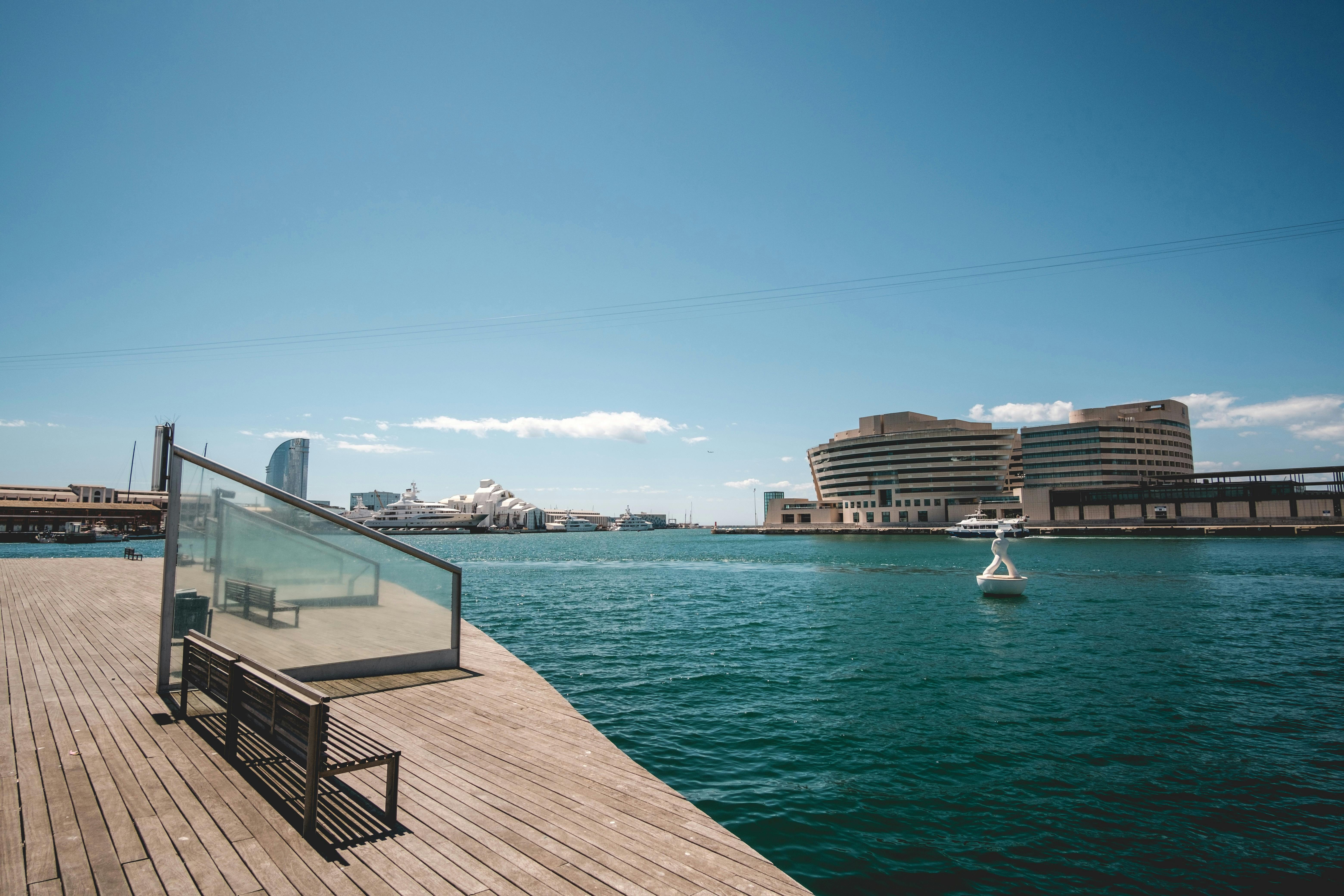 wooden pier in city harbor