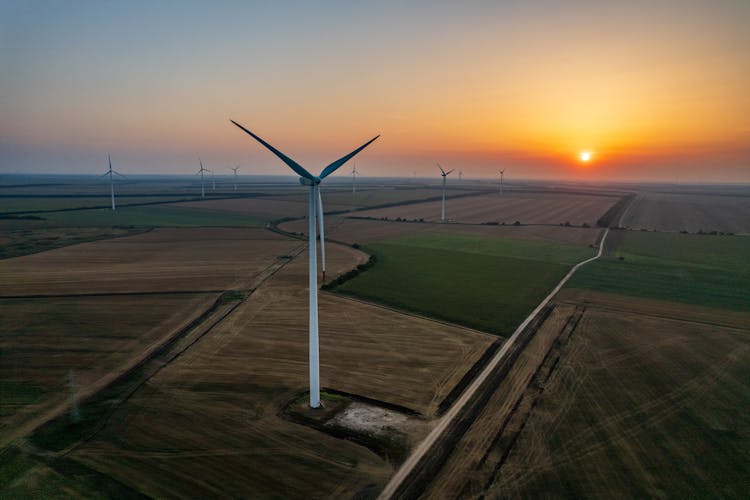 Aerial Shot Of Wind Farm During Golden Hour 