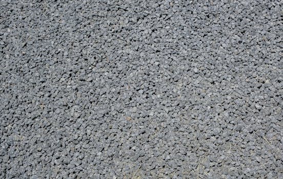 Close-up of gravel rocks forming a textured background, ideal for construction themes.