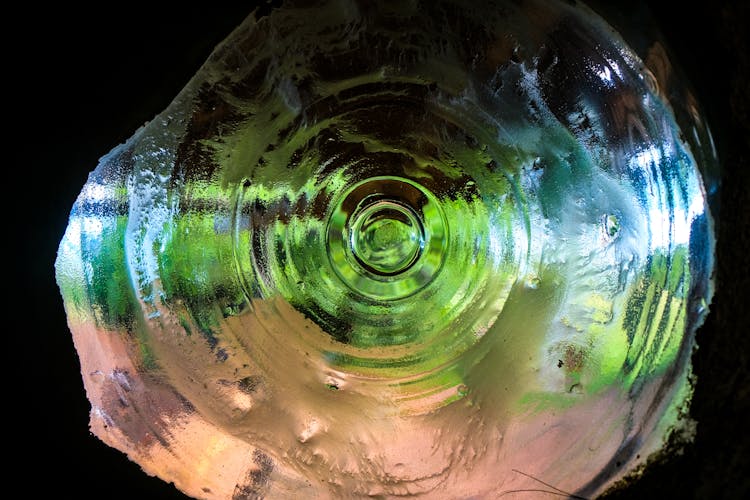 The Bottom Of Glass Bottle In Close-Up Shot 