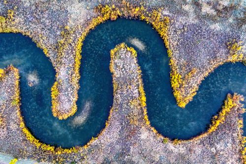 Free Stunning aerial shot capturing a curvy river in Rochester, MN during fall. Stock Photo