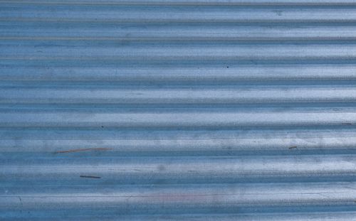 Free Close-up of corrugated blue metal surface with texture patterns, perfect for backgrounds. Stock Photo