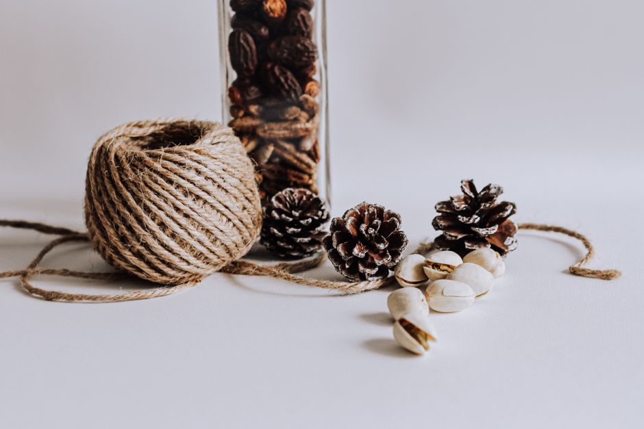 Assortment of foraged natural materials like pinecones, acorns, and smooth river rocks - rural diy nature crafts Assortment of foraged natural materials like pinecones, acorns, and smooth river rocks - rural diy nature crafts