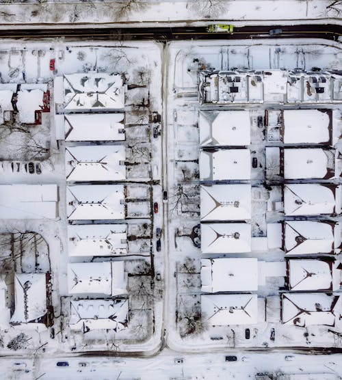 An Aerial Shot of a Snow Covered Neighborhood