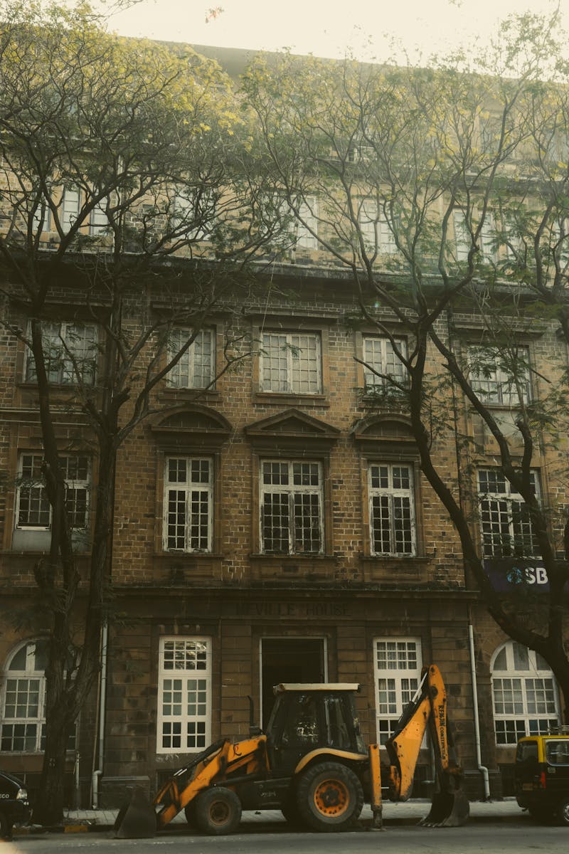 Brown Concrete Building Near Bare Trees