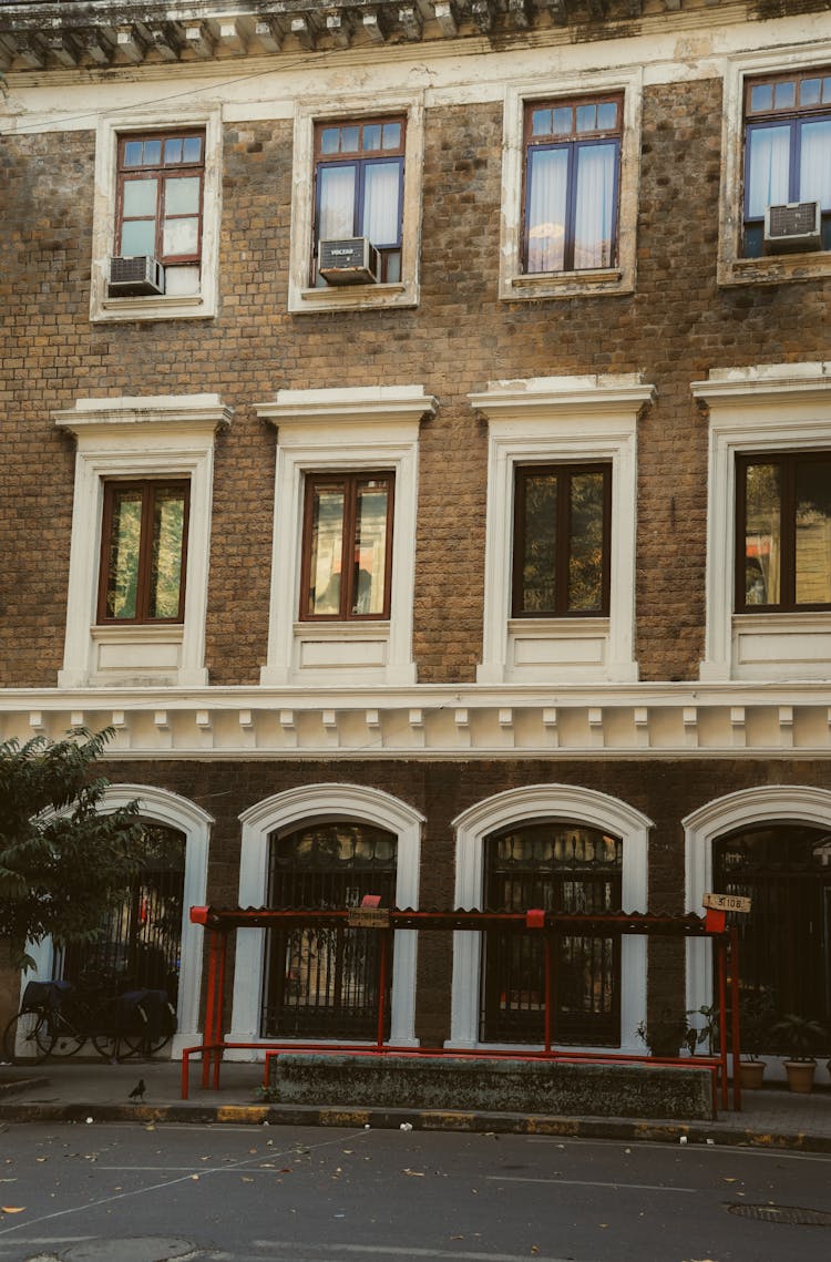 Brick Townhouse Facade And Reflection In Windows