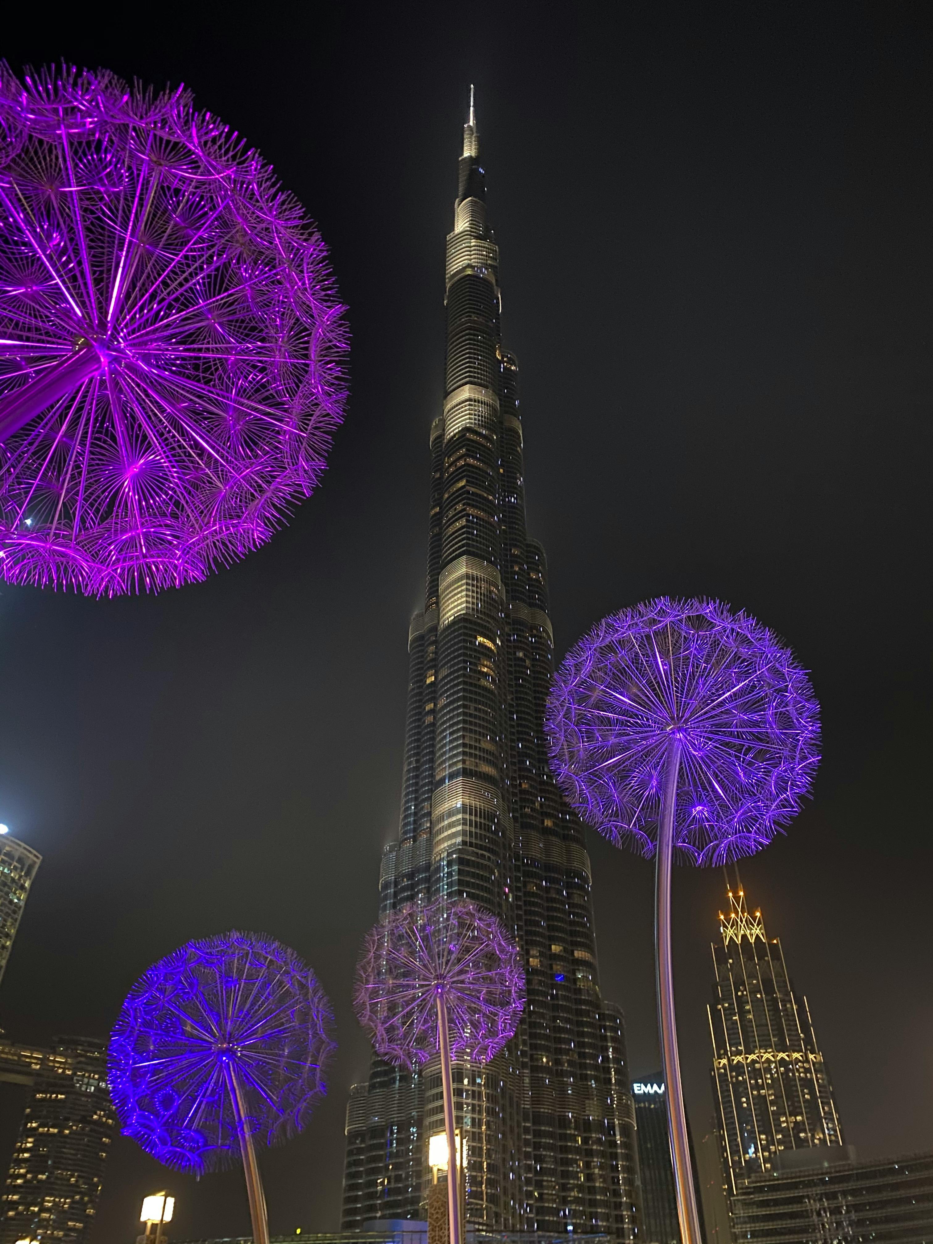 Photo of a the Burj Khalifa Skyscraper, the Fountain and a Boat in ...