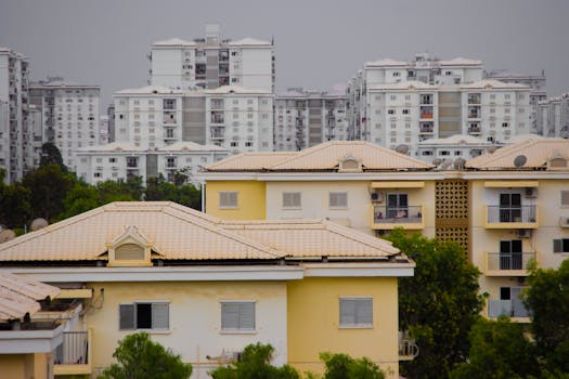 View of urban residential buildings showcasing modern architecture amidst greenery.