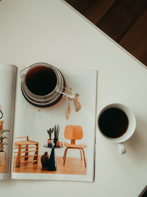 Free White Ceramic Mug with Black Coffee on White Table Stock Photo