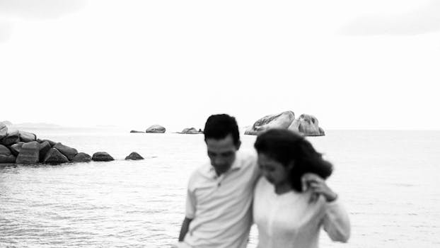 A couple enjoying a romantic moment by the ocean in Bangka Belitung Islands, Indonesia.