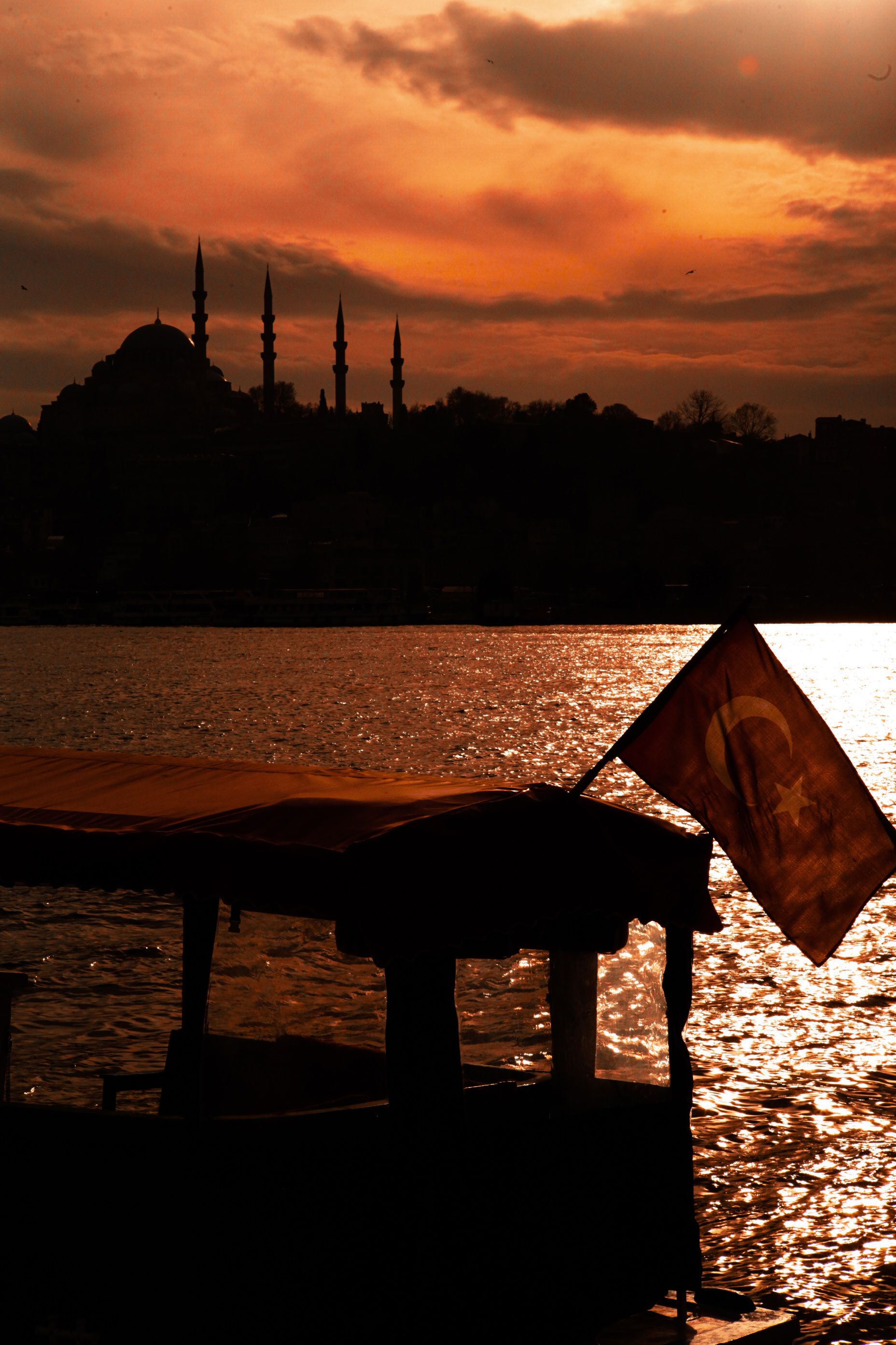 Silhouette of a Boat on Body of Water · Free Stock Photo