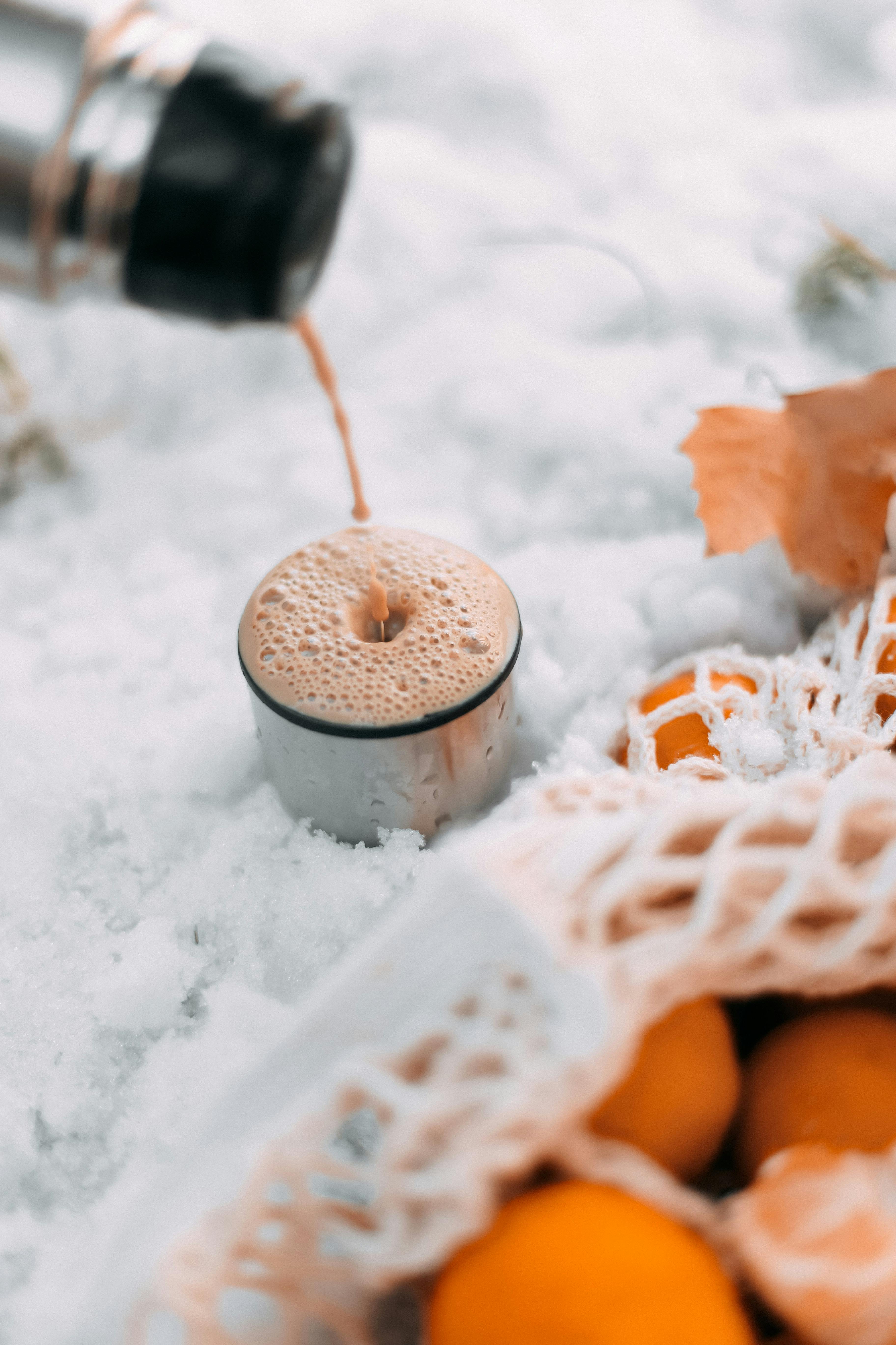 Pouring Hot Tea From Thermos Into Cup Stock Photo - Download Image