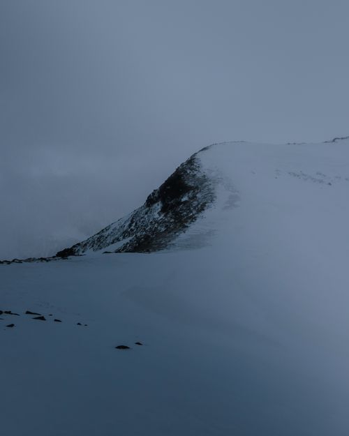 Free A serene winter landscape of a snow-covered mountain peak in Dombay, Russia. Stock Photo