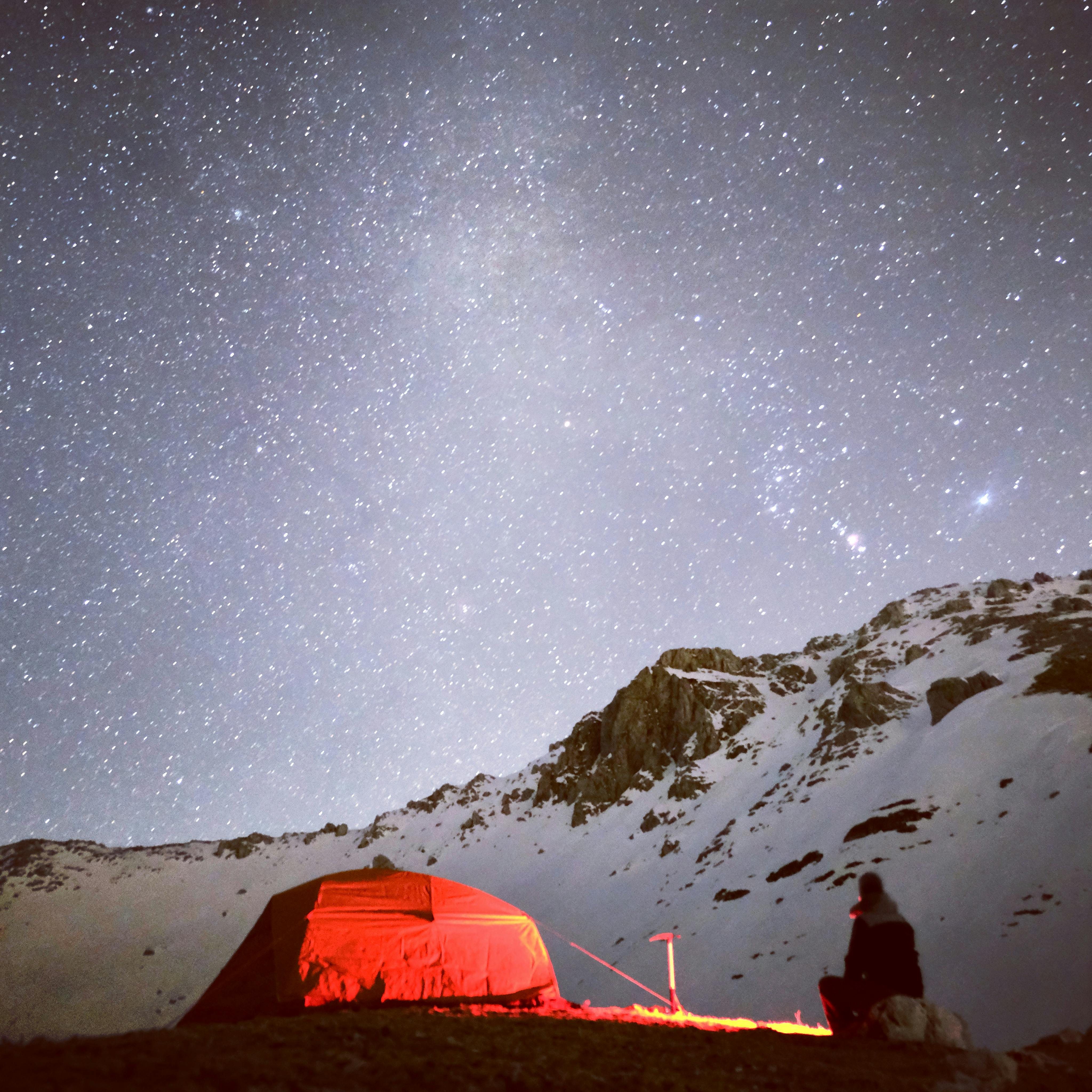 Prescription Goggle Inserts - A tent under a starry night sky in snowy mountains, perfect for adventure.