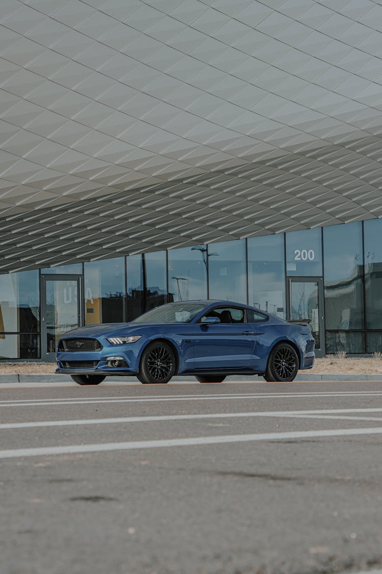 Blue Ford Mustang In Car Park