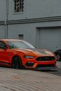 Orange Bmw M 3 Coupe Parked Near Building