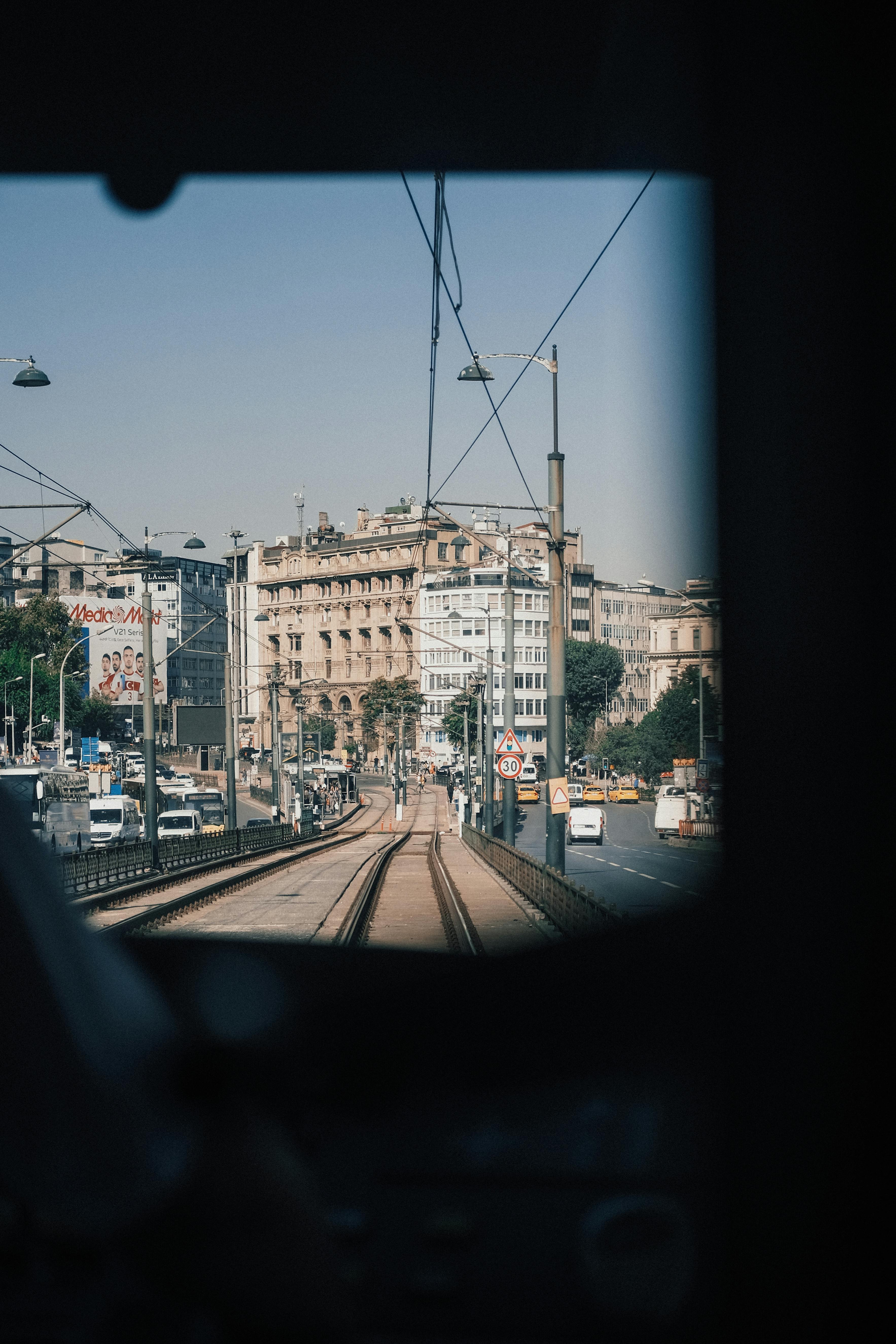 Captivating view of Istanbul's urban landscape from a tram, showcasing historic architecture.