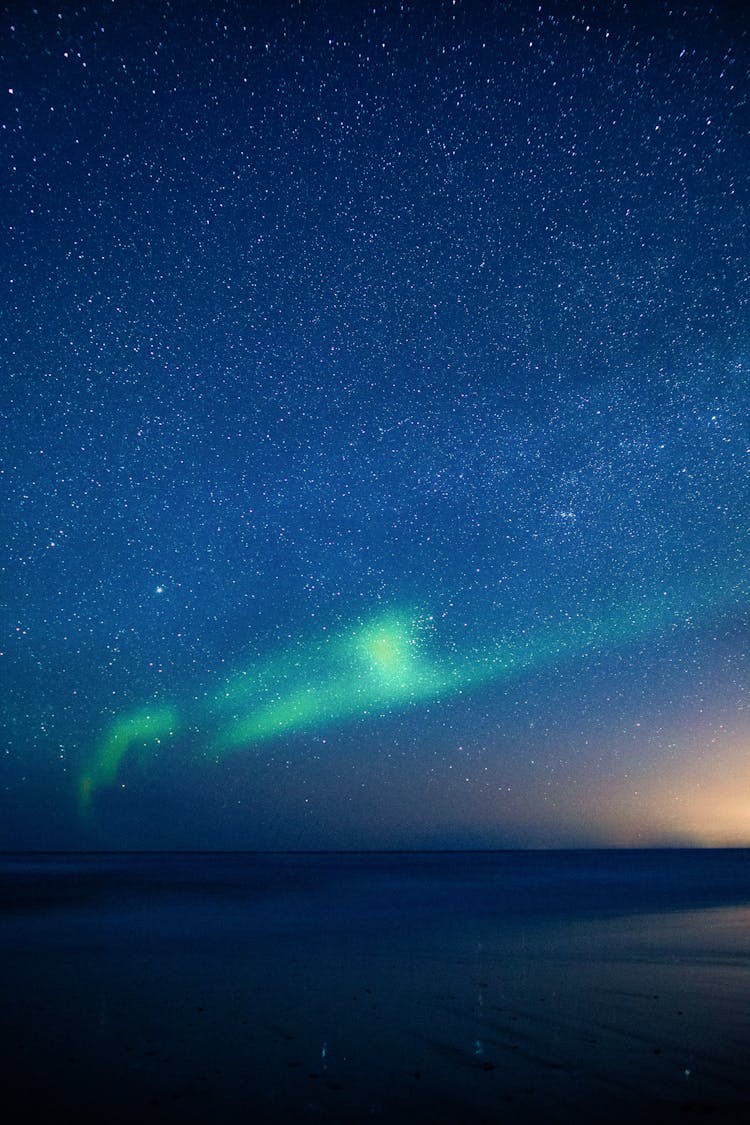 Green And Blue Sky With Sparkling Stars