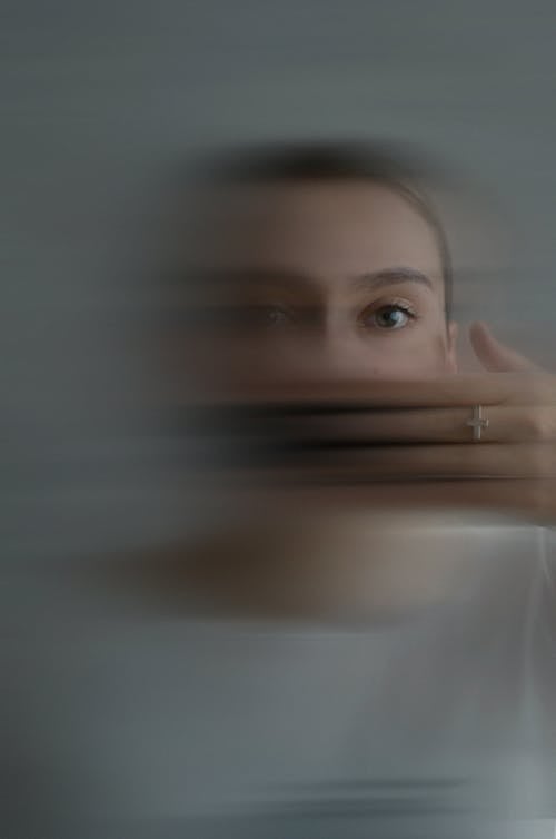 Free Woman Covering Her Face With Her Hand Stock Photo