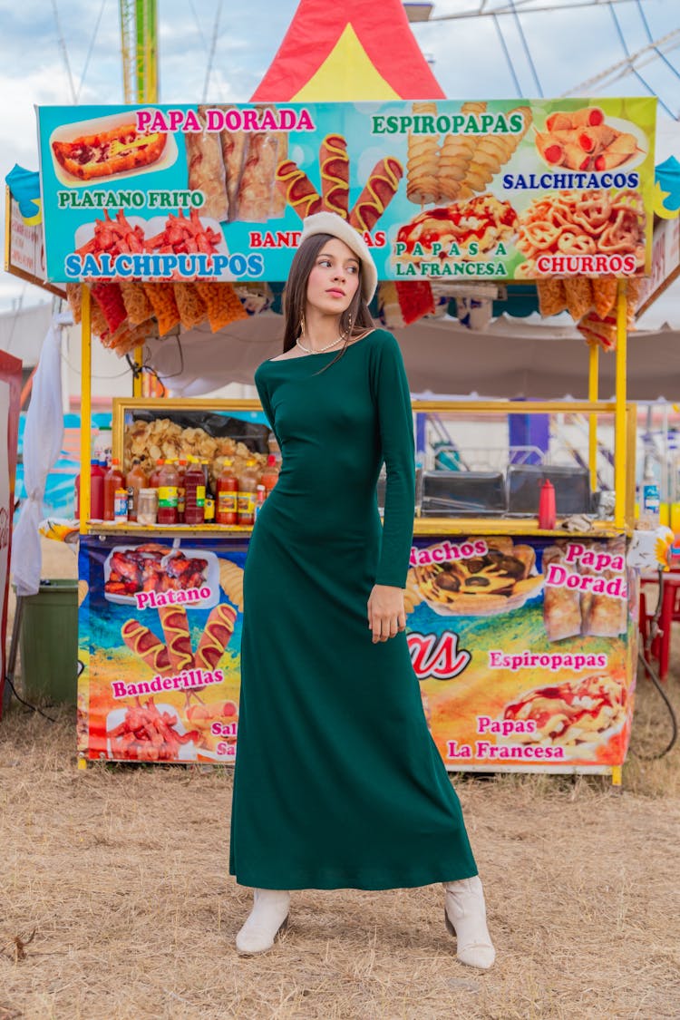 Girl In Dress Standing Next To Food Stand At Fair