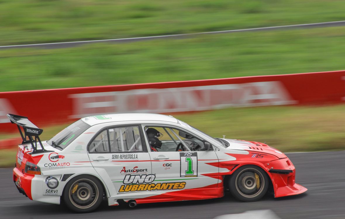 Race Car on a Speedway · Free Stock Photo