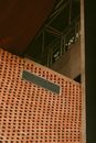 Brown Brick Building With White Window Type Air Conditioner