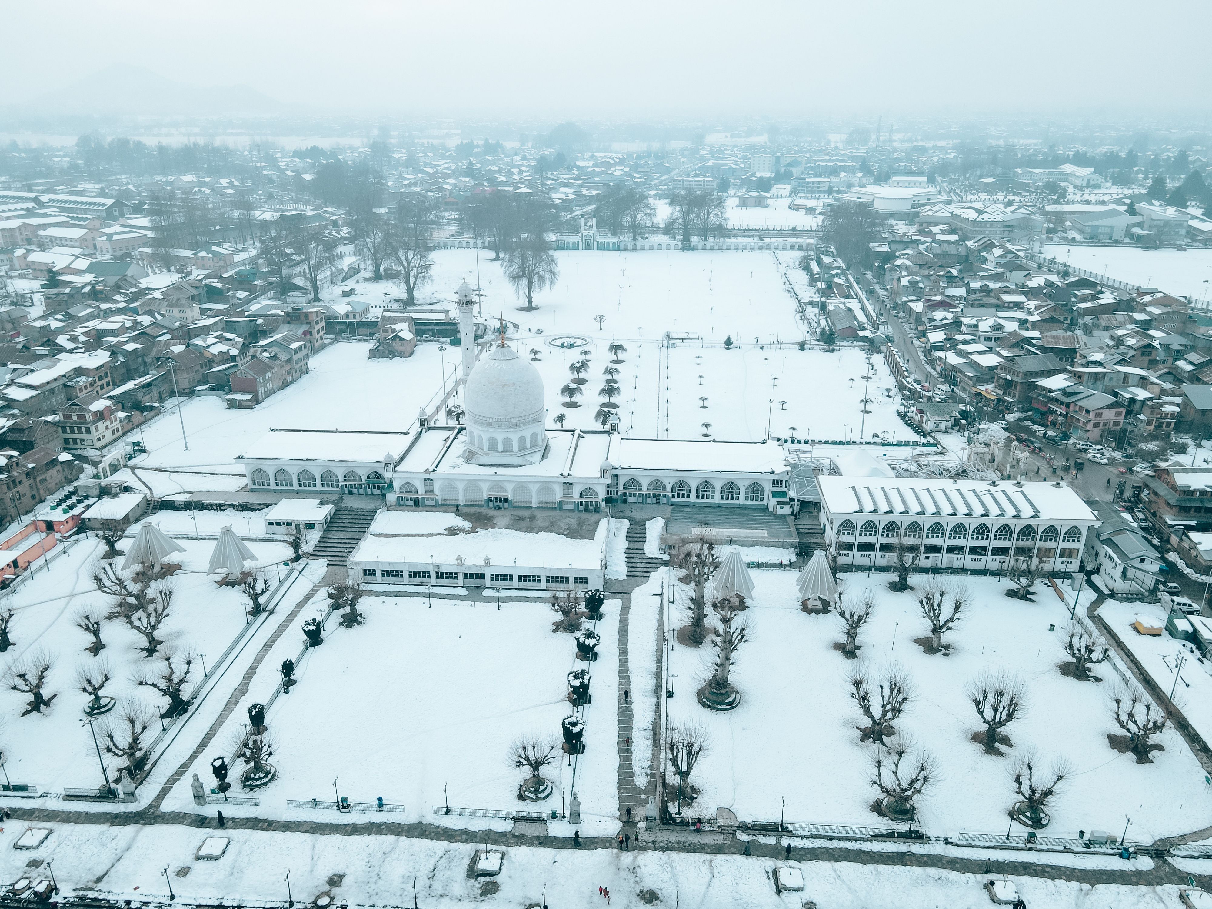 Aerial View of Snow Covered Ground and Buildings · Free Stock Photo