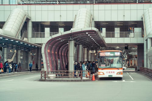 People Standing at a Bus Station