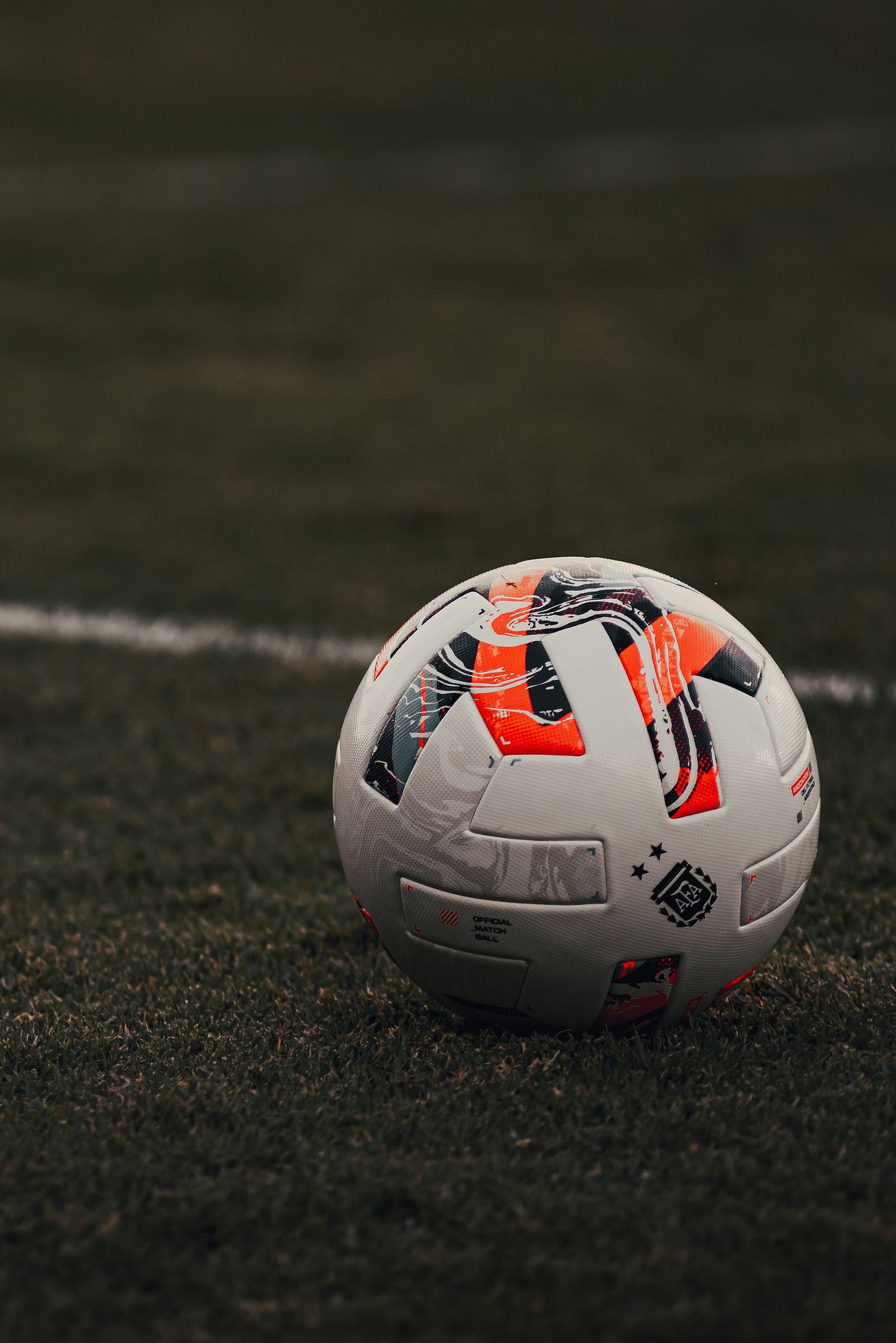 Match football resting on the pitch
