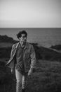 Young Handsome Man Marching Through Meadows at Seaside