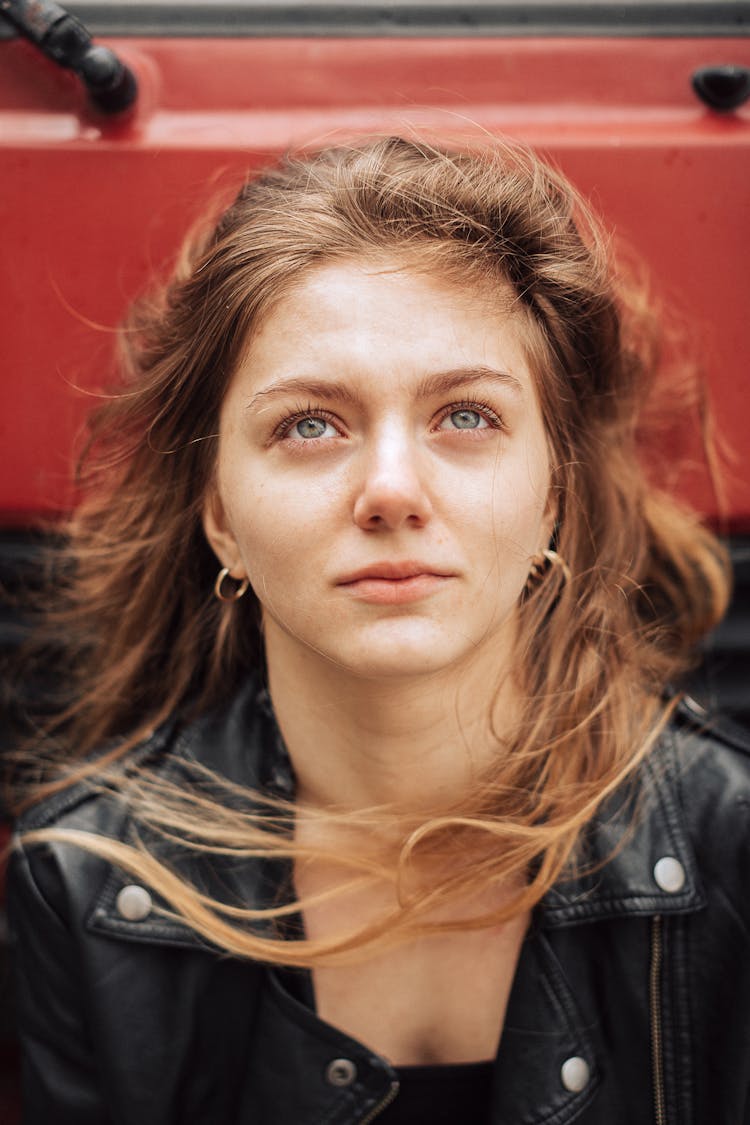 Woman With Long Brown Hair In Black Leather Jacket 