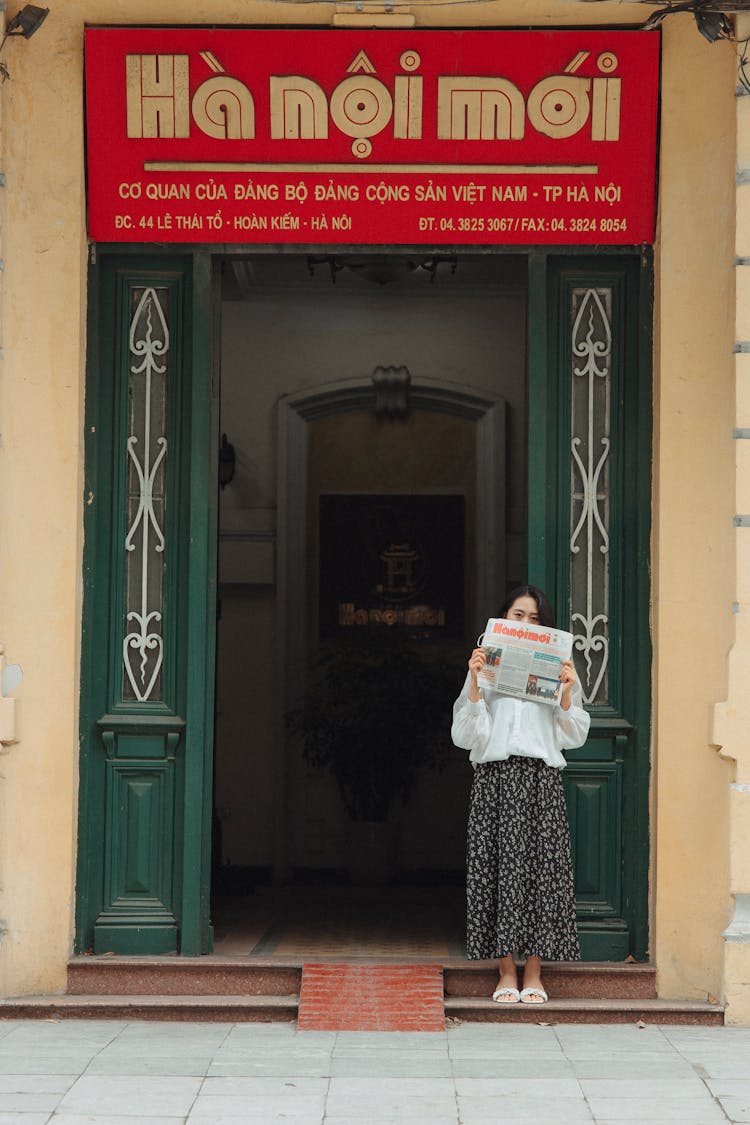 Woman Reading Newspaper