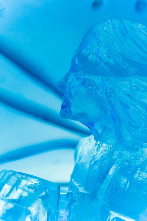 Free Detailed image of an abstract blue ice sculpture, capturing light and texture. Stock Photo