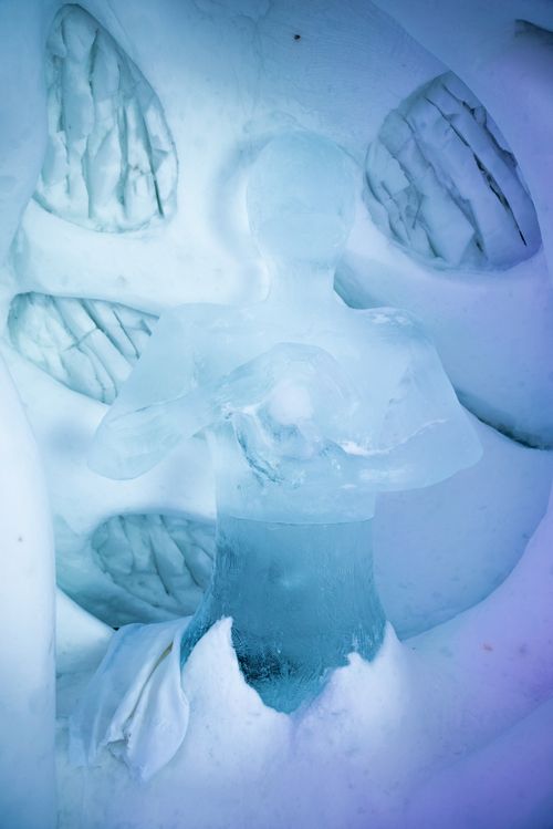 Free A detailed ice sculpture depicting a human shape, showcasing intricate ice carving techniques. Stock Photo