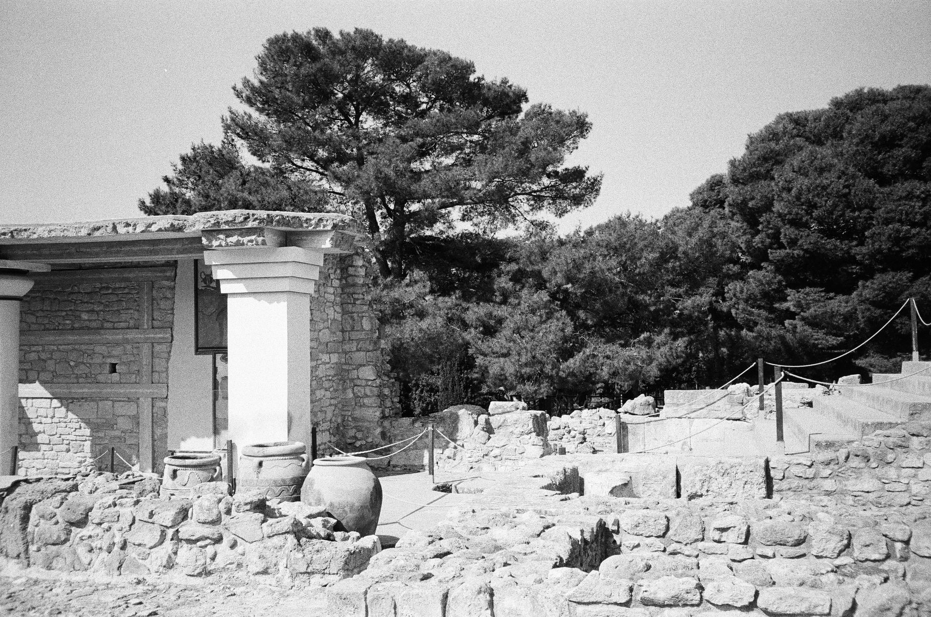 Explore the historic Knossos ruins in Crete with this timeless black and white image.
