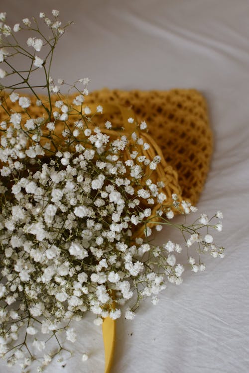 Free Baby's Breath Flowers on a Crochet Bag Stock Photo
