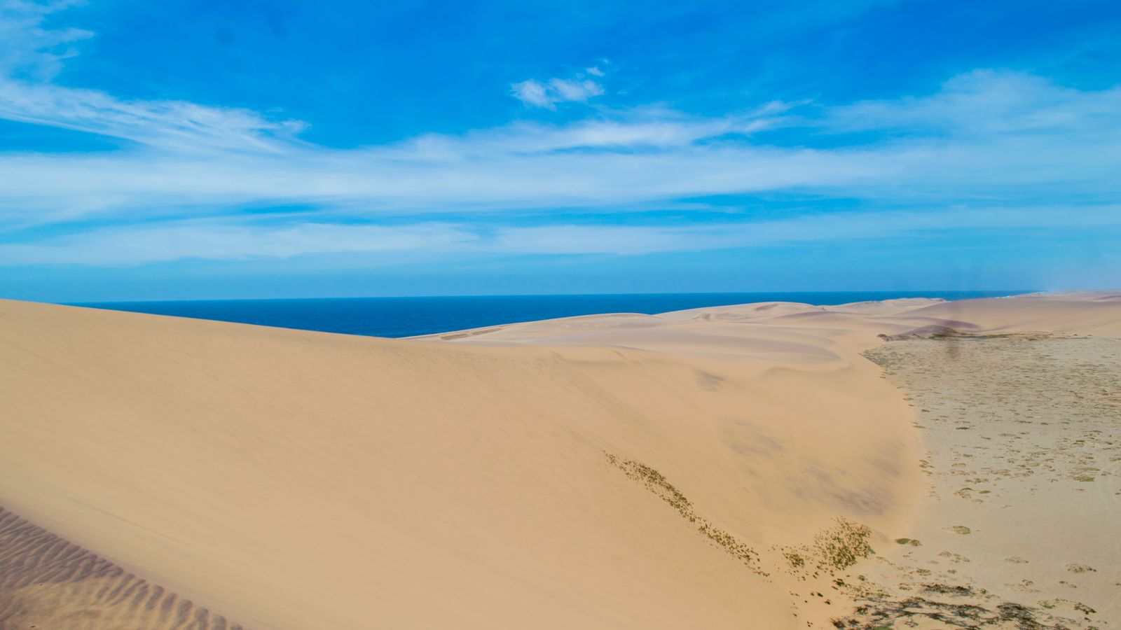 Hill of sand by the sea, Angola