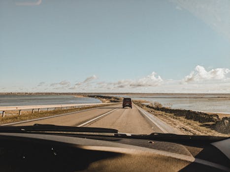 A serene drive along a coastal road in Odesa, capturing open skies and tranquil waters.