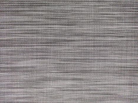 Close-up view of a black and white woven textile fabric with intricate patterns.