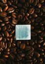 White Card on Brown Coffee Beans
