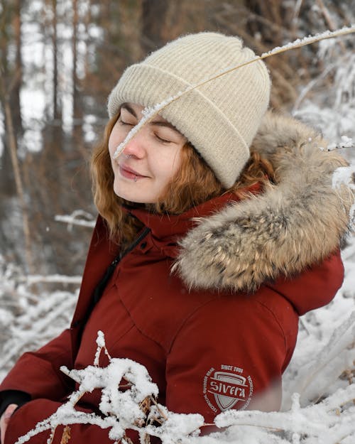 A Woman Wearing Brown Beanie Hat While Eyes Closed